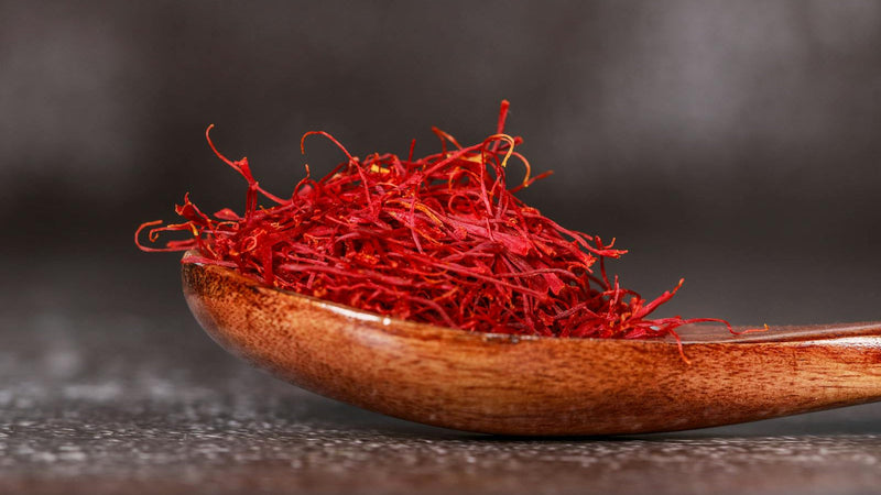Measuring a pinch of saffron threads with Raihan Afghan Super Negin saffron